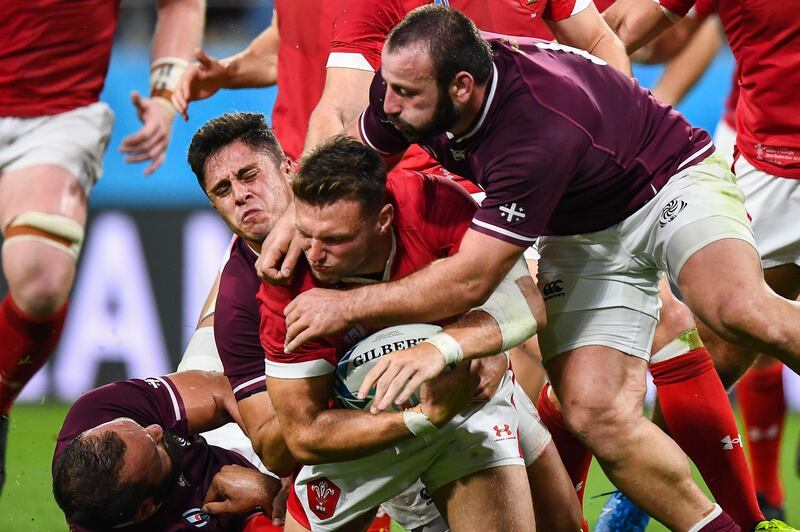 Wales' fly-half Dan Biggar is tackled during the match against Georgia on Monday. AFP