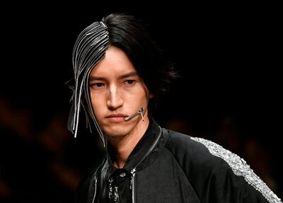 epa06622859 A model presents a creation from the Autumn/Winter 2018 collection by South Korean designer Chanu for the label 'ACUOD by CHANU' during the Tokyo Fashion Week, in Tokyo, Japan, 23 March 2018. The presentation of the collections runs from 19 to 24 March.  EPA/FRANCK ROBICHON