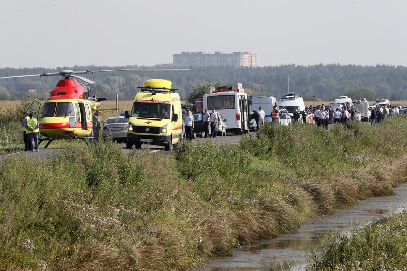 Ambulances on the road near the site of Ural Airlines A-321 passenger plane emergency landing outside Zhukovsky airport in Ramensky district of Moscow region, Russia. A-321 with 226 passengers and seven crew members on board en-route from Moscow to Simferopol made emergency landing after a right engine failure following the plane's colliding with seagulls shortly after take-off. Ten people were hospitalized following the accident.  EPA