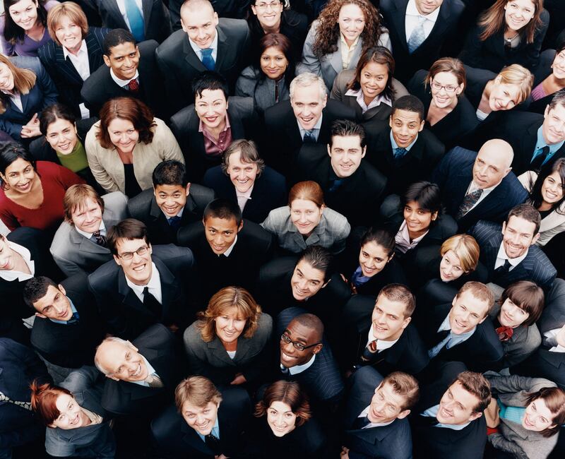 Large Group of Business People Standing and Looking up at Camera