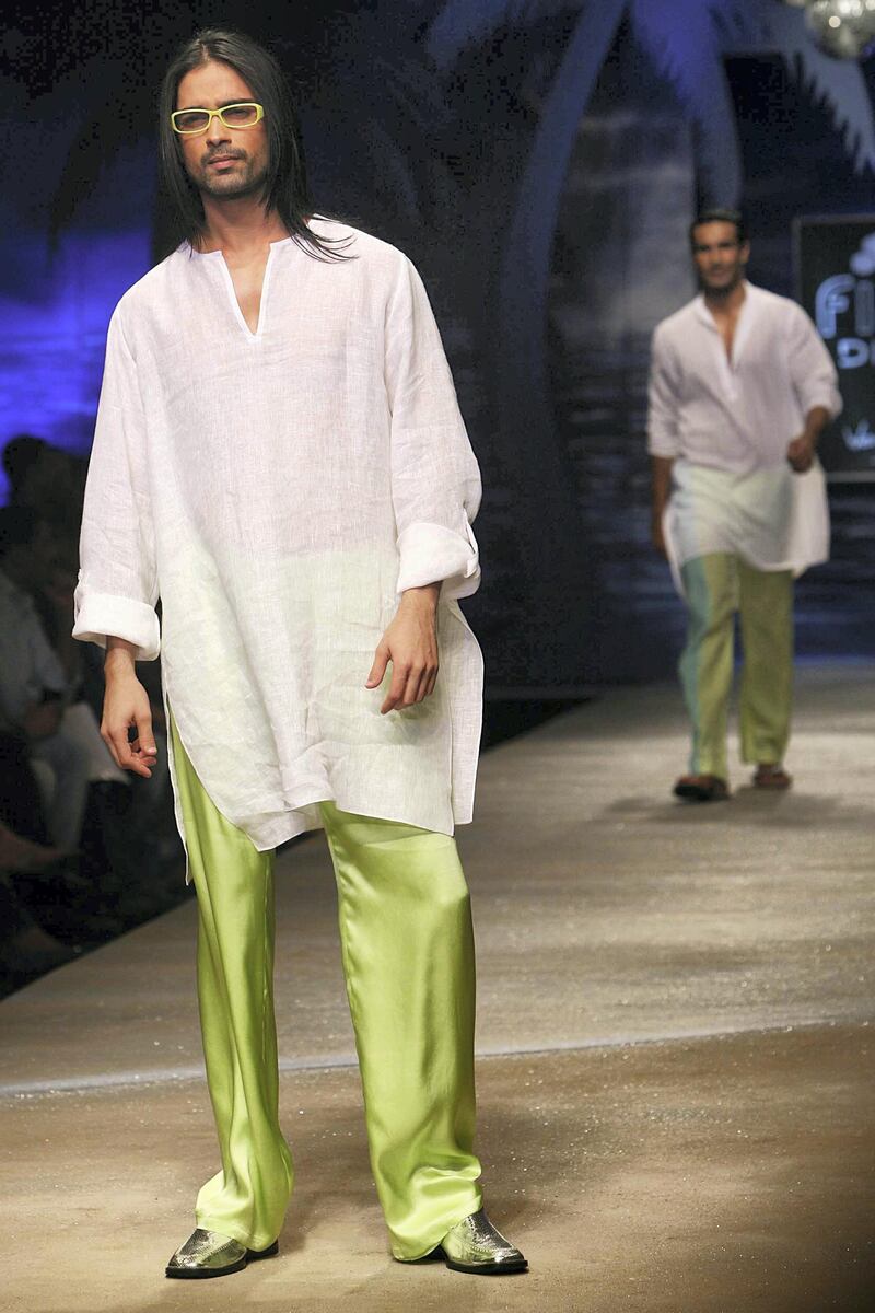 NEW DELHI, INDIA - OCTOBER 10: A male model walks the ramp for designer Wendell Rodricks at the Wills Lifestyle India Fashion Week Spring Summer 2012, in New Delhi, India, Monday, October 10, 2011. (Photo by Ramesh Sharma/The India Today Group via Getty Images)