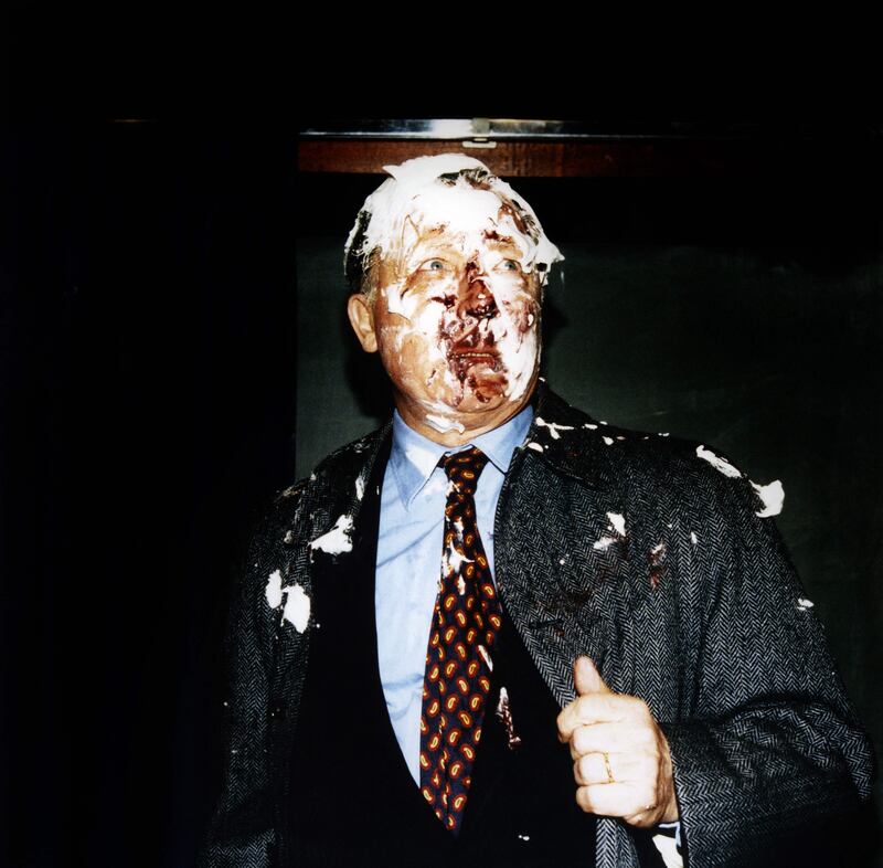 Mr Delors wipes his face after being hit with a cream pie by militants from an anti-Maastricht committee, south-eastern France, on 30 April 1997. AFP