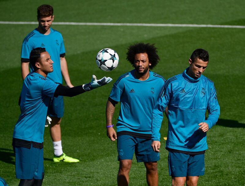 Goalkeeper Keylor Navas, left, defender Marcelo, centre, and Cristiano Ronaldo during training. Pierre-Hillipe Marcou / AFP