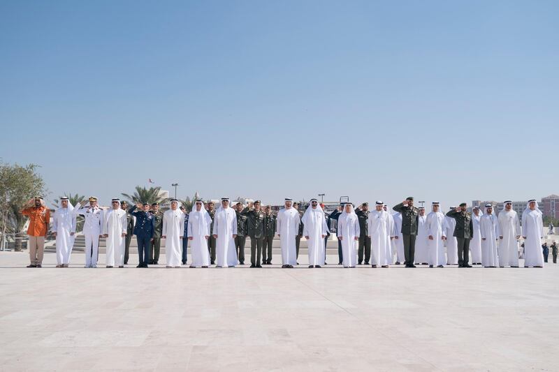 ABU DHABI, UNITED ARAB EMIRATES - November 30, 2017: HE Jaber Al Suwaidi, General Director of the Crown Prince Court - Abu Dhabi (R), HE Mohamed Mubarak Al Mazrouei, Undersecretary of the Crown Prince Court of Abu Dhabi (2nd R), HH Sheikh Khalifa bin Tahnoon bin Mohamed Al Nahyan, Director of the Martyrs' Families' Affairs Office of the Abu Dhabi Crown Prince Court (3rd R), HH Sheikh Khaled bin Zayed Al Nahyan, Chairman of the Board of Zayed Higher Organization for Humanitarian Care and Special Needs (ZHO) (5th R), HE Brigadier General Saleh Mohamed Saleh Al Ameri, Commander of the UAE Ground Forces (6th R), HH Sheikh Abdullah bin Zayed Al Nahyan, UAE Minister of Foreign Affairs and International Cooperation (7th R), HH Sheikh Hazza bin Zayed Al Nahyan, Vice Chairman of the Abu Dhabi Executive Council (8th R), HE Mohamed Ahmad Al Bowardi, UAE Minister of State for Defence Affairs (9th R), HH Sheikh Mohamed bin Zayed Al Nahyan, Crown Prince of Abu Dhabi and Deputy Supreme Commander of the UAE Armed Forces (10th R), HE Lt General Hamad Thani Al Romaithi, Chief of Staff UAE Armed Forces (11th R), HH Sheikh Saeed bin Zayed Al Nahyan, Abu Dhabi Ruler's Representative (12th R), HH Lt General Sheikh Saif bin Zayed Al Nahyan, UAE Deputy Prime Minister and Minister of Interior (13th R), HH Sheikh Mansour bin Zayed Al Nahyan, UAE Deputy Prime Minister and Minister of Presidential Affairs (14th R), HE Major General Essa Saif Al Mazrouei, Deputy Chief of Staff of the UAE Armed Forces (15th R), HH Sheikh Hamed bin Zayed Al Nahyan, Chairman of the Crown Prince Court of Abu Dhabi and Abu Dhabi Executive Council Member (16th R), Rear Admiral Pilot HH Sheikh Saeed bin Hamdan bin Mohamed Al Nahyan, Commander of the UAE Naval Forces (17th R), HH Sheikh Omar bin Zayed Al Nahyan, Deputy Chairman of the Board of Trustees of Zayed bin Sultan Al Nahyan Charitable and Humanitarian Foundation (18th R) and HE Major General Abdullah Muhair Al Ketbi (19th R), observe a moment of silence during 