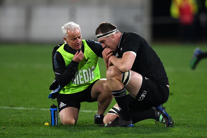 Brodie Rettalick of the All Blacks receives medical assistance. Getty