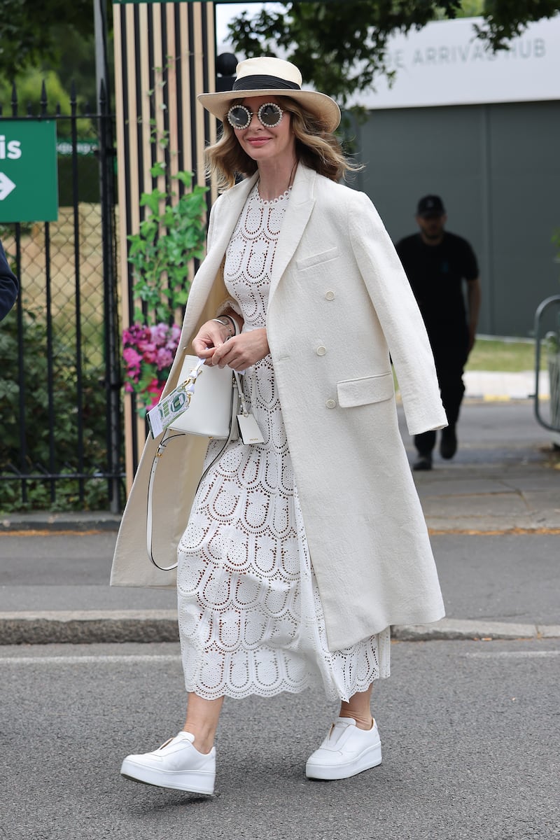 Fashion and makeover expert Trinny Woodall arrives at the All England Lawn Tennis and Croquet Club. GC Images