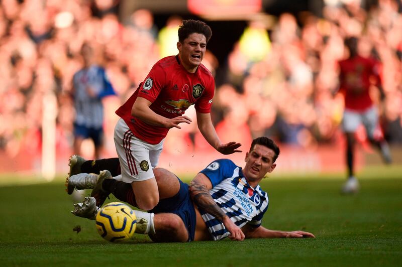 Manchester United midfielder Daniel James, left, is fouled by Brighton's Lewis Dunk during their match at Old Trafford on Sunday. AFP