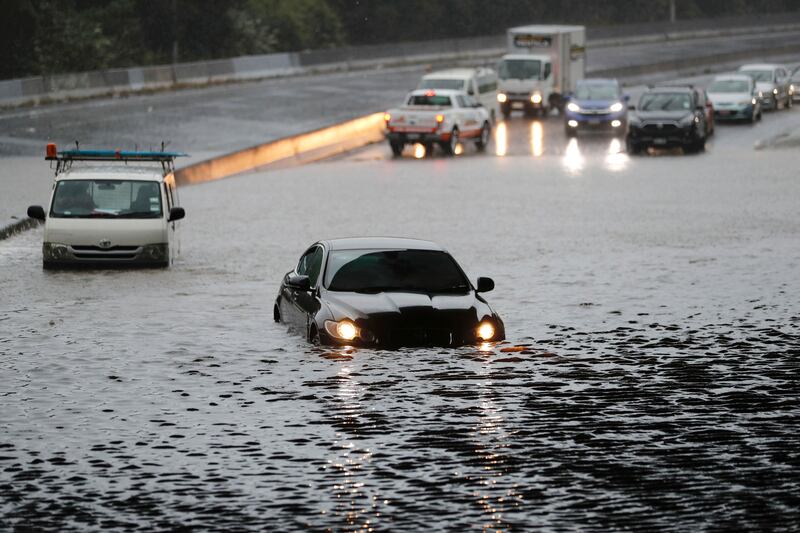 Vehicles stranded by floodwater in Auckland. AP
