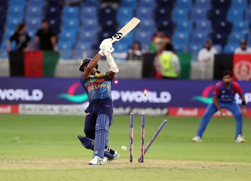 Sri Lanka's Chamika Karunaratne is bowled by Afghanistan's Fazalhaq Farooqi during the opening game of Asia Cup 2022 in Dubai on Saturday, August 27, 2022. Chris Whiteoak / The National