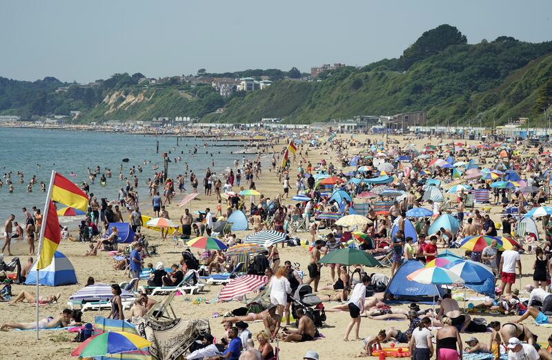 Bournemouth beach is packed with sun-seekers. PA