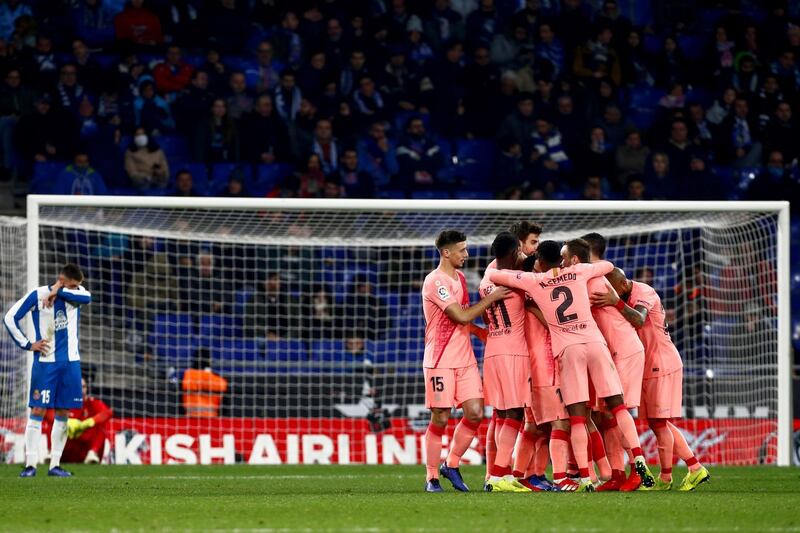 Barcelona players celebrate a goal against Espanyol. EPA