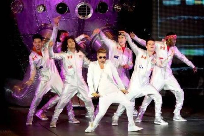 Justin Bieber’s over-choreographed show might be drawing attention away from his vocal talent. Justin Tallis / AFP