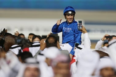 Horse Racing - Dubai World Cup - Meydan Racecourse, Dubai, United Arab Emirates - March 30, 2019 Christophe Soumillon celebrates winning the Dubai World Cup Sponsored By Emirates Airline on Thunder Snow REUTERS/Christopher Pike