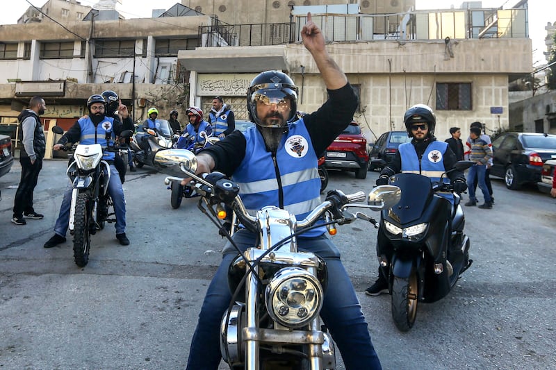 Members of a motorcycle club distribute iftar in Damascus.  AFP