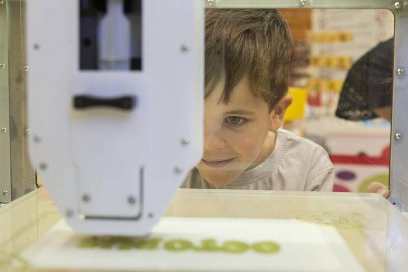 At last, to the delight of Joshua Ahlers, a truly worthwhile use has been found for 3-D printing – making sweets. Joshua, 6, on Monday watched closely as a new 3-D printer went to work in the Candylicious shop in Dubai Mall. Antonie Robertson / The National
