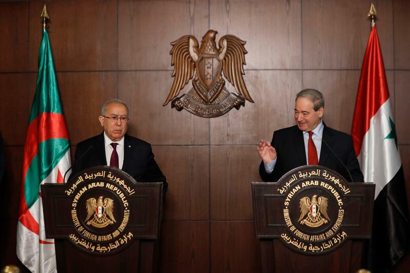 Syrian Foreign Minister Faisal Mekdad, right, speaks during a joint press conference with Algerian Foreign Minister Ramtane Lamamra in Damascus, Syria, Monday, July 25, 2022.  Mr Lamamra on Monday decried Syria's decade-long suspension from the Arab League, and hinted at supporting their return to the organisation, during a visit in Damascus. AP Photo