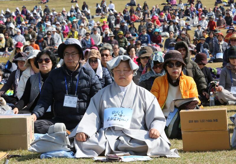 Buddhist believers attend the Demilitarized Zone World Peace Meditation Event at Imjingak Pavilion in Paju near the demilitarised zone of Panmunjom, South Korea. AP Photo