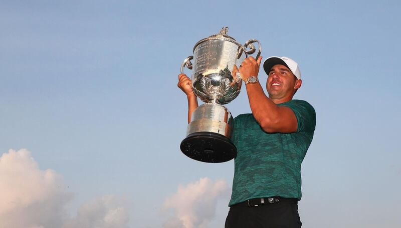 ST LOUIS, MO - AUGUST 12: Brooks Koepka of the United States poses with the Wanamaker Trophy on the 18th green after winning the 2018 PGA Championship with a score of -16 at Bellerive Country Club on August 12, 2018 in St Louis, Missouri.   Jamie Squire/Getty Images/AFP
== FOR NEWSPAPERS, INTERNET, TELCOS & TELEVISION USE ONLY ==
