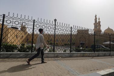 A man walks past the closed Al Azhar Mosque in Cairo which has been closed along with other places of worship to stop the spread of coronavirus in Egypt. Reuters