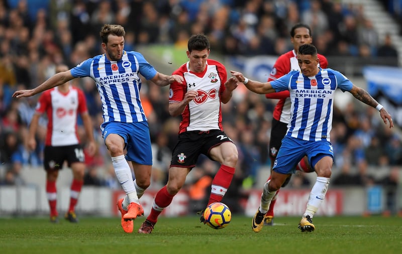 Soccer Football - Premier League - Brighton & Hove Albion vs Southampton - The American Express Community Stadium, Brighton, Britain - October 29, 2017   Southampton's Pierre-Emile Hojbjerg in action with Brighton's Dale Stephens and Anthony Knockaert    Action Images via Reuters/Tony O'Brien    EDITORIAL USE ONLY. No use with unauthorized audio, video, data, fixture lists, club/league logos or "live" services. Online in-match use limited to 75 images, no video emulation. No use in betting, games or single club/league/player publications. Please contact your account representative for further details.