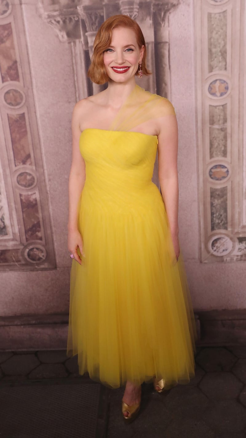 Jessica Chastain, in a floaty yellow Ralph Lauren sheer-strapped dress, attends the Ralph Lauren show during New York Fashion Week on September 7, 2018. AFP