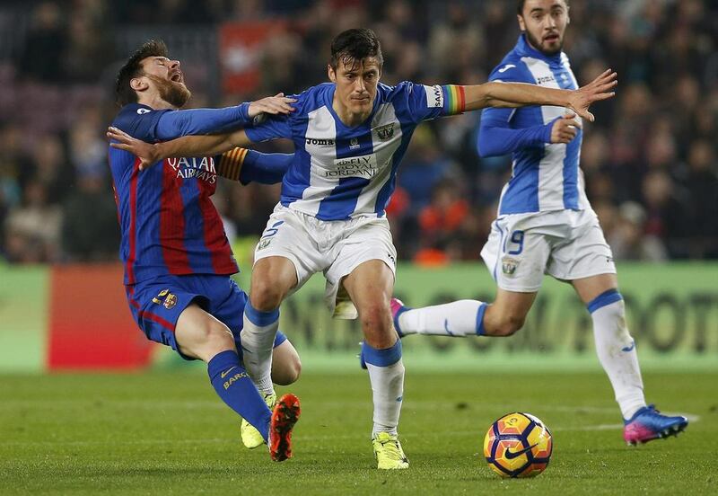 Barcelona’s Lionel Messi in action against Leganes’ Diego Rico. Albert Gea / Reuters