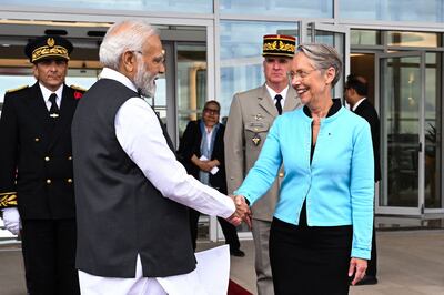 France's Prime Minister Elisabeth Borne welcomes Mr Modi at Orly Airport, near Paris. AFP