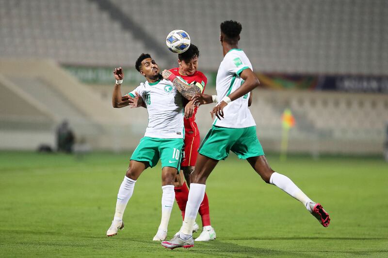Saudi Arabia's Salem Al Dawsari tries to head the ball.