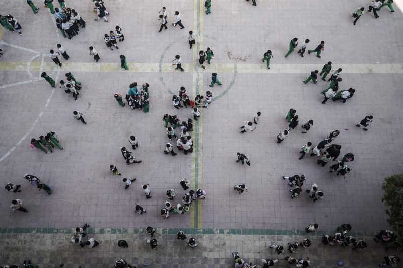 Pupils gather in the courtyard of the Mahaba school in Ezbet Al Nakhl,  Cairo, Egyp. Mohamed el-Shahed / AFP
