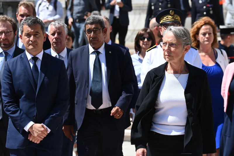 French Prime Minister Elisabeth Borne, right, and Interior and Overseas Minister Gerald Darmanin, left, leave the Haute Savoie prefecture after a stabbing attack in Annecy. AFP