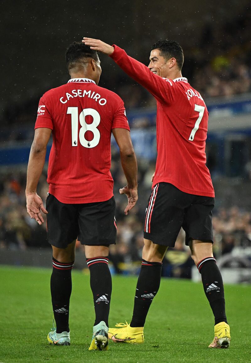 Manchester United's  Cristiano Ronaldo celebrates scoring his team's second goal with Casemiro. AFP