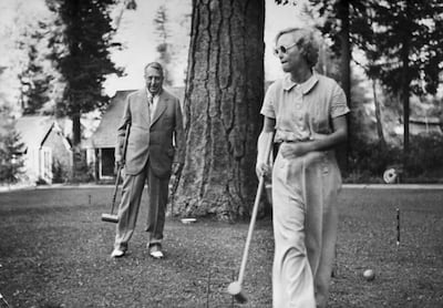 Newspaper magnate William Randolph Hearst and actress Marion Davies playing croquet on the grounds at The Beverly House 