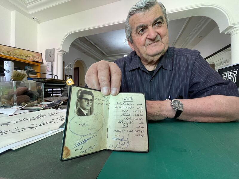 Mr Tabbal shows his work ID from 1968, when he started working at the Jordan Petroleum Refinery Company