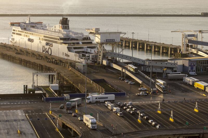 Lorries leave a passenger and cargo ship at the Port of Dover in England on January 30. Bloomberg