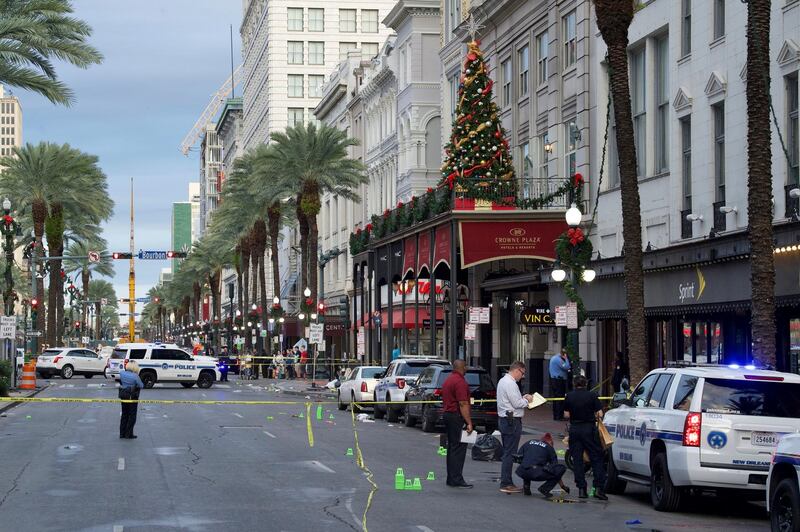 New Orleans police investigate the scene of a shooting Sunday, Dec. 1, 2019, on the edge of the city's famed French Quarter in New Orleans.  (Max Becherer/The Advocate via AP)