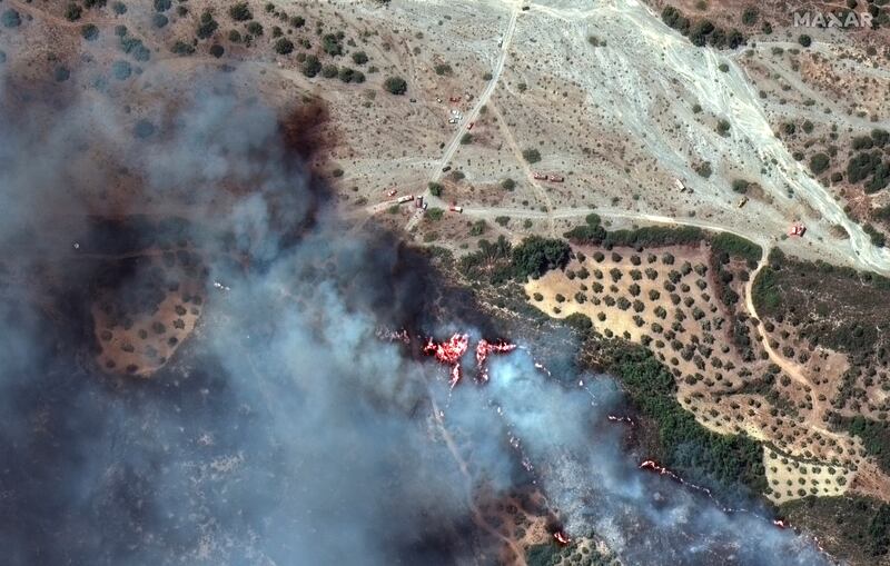 Planes are being used to douse the fires which have been burning for eight days on Rhodes. AP