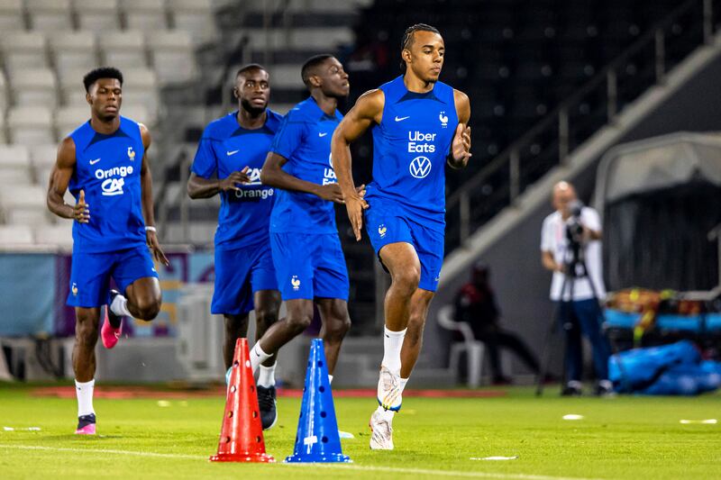 France's Jules Kounde and teammates attend a training session in Doha. EPA