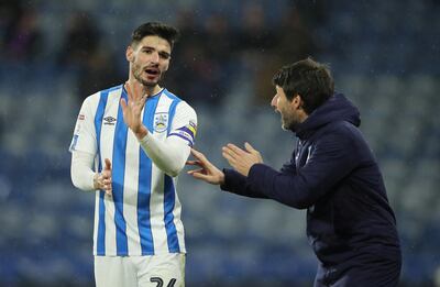 Soccer Football - Championship - Huddersfield Town v Bristol City - John Smith's Stadium, Huddersfield, Britain - February 25, 2020   Huddersfield Town's Christopher Schindler and manager Danny Cowley   Action Images/Molly Darlington    EDITORIAL USE ONLY. No use with unauthorized audio, video, data, fixture lists, club/league logos or "live" services. Online in-match use limited to 75 images, no video emulation. No use in betting, games or single club/league/player publications.  Please contact your account representative for further details.