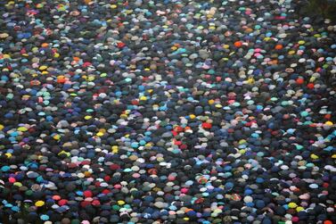 Demonstrators hold umbrellas at Victoria Park as rain falls during a protest in the Causeway Bay district of Hong Kong. Bloomberg