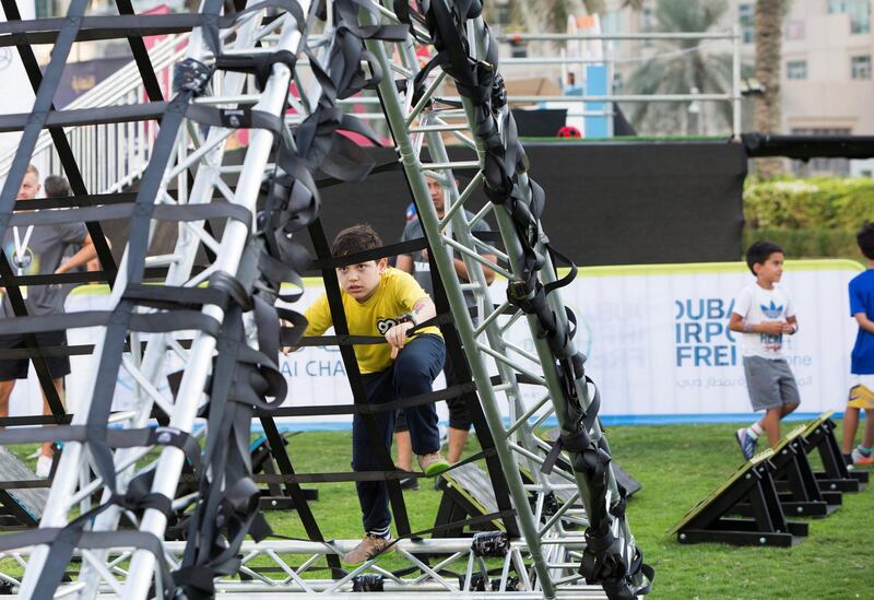 DUBAI, UNITED ARAB EMIRATES - kids doing an obstacle course at the closing weekend carnival of the second year of the Dubai Fitness Challenge at Burj Park, Dubai.  Leslie Pableo for The National
