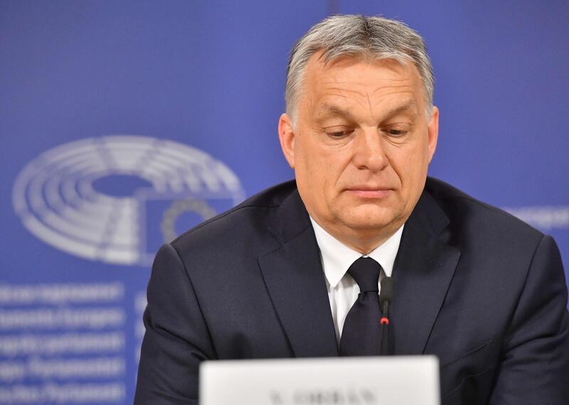 Hungary's Prime Minister Victor Orban addresses a press conference at the end of a European People's Party (EPP) meeting at the European Parliament in Brussels on March 20, 2019.  The Fidesz party of firebrand Hungarian Prime Minister Viktor Orban was hit with a temporary suspension from the European People's Party. Fidesz had faced expulsion after running a controversial billboard campaign that accused European Commission head Jean-Claude Juncker and liberal US billionaire George Soros, a bete-noir of Orban, of plotting to flood Europe with migrants.   / AFP / EMMANUEL DUNAND
