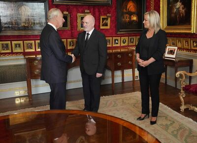 Britain's King Charles III, left, meets Alex Maskey and Michelle O'Neill, both senior Sinn Fein party members in the National Assembly. AFP