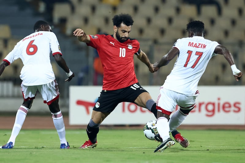 Egypt's forward Mohamed Salah challenges Sudan's defender Mustafa Karshom. AFP
