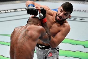 Amir Albazi, right, won his fight against Malcolm Gordon of Canada at UFC Fight Island in Abu Dhabi. Zuffa LLC via Getty Images