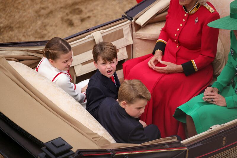 Princess Charlotte, Prince Louis and Prince George arrive by carriage at Horse Guards Parade with Queen Camilla and Catherine, Princess of Wales. Reuters
