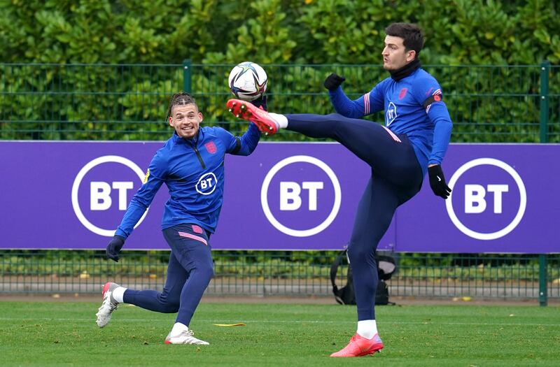 Kalvin Phillips, left, and Harry Maguire battle for the ball during training. PA