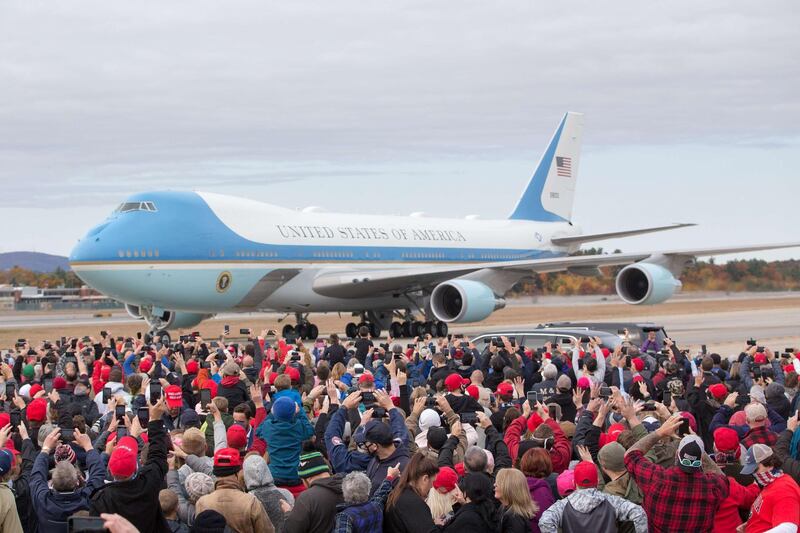 Air Force One, carrying U.S. President Donald Trump, arrives at Manchester-Boston International Airport at a campaign rally as supporters wait in Londonderry, New Hampshire. AFP