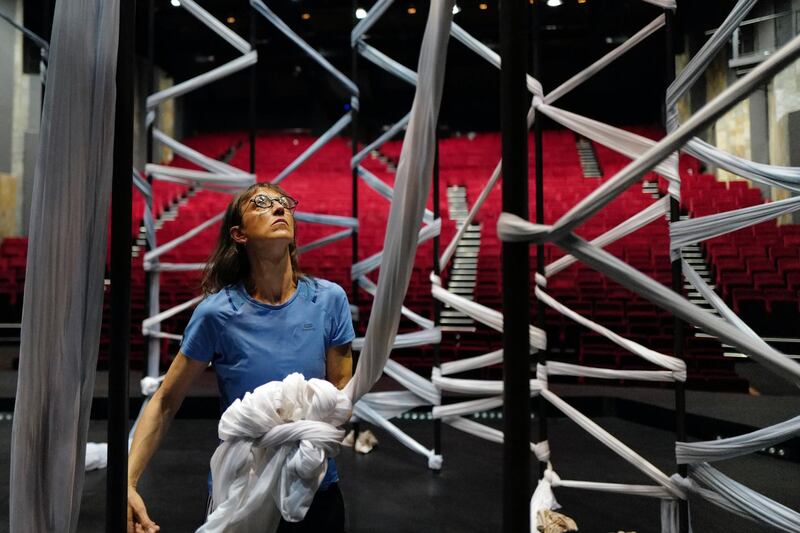 Sylvie Guillermin, choreographer of "Parallèle 26" prepares the stage at Theatre de La Criee. AP Photo