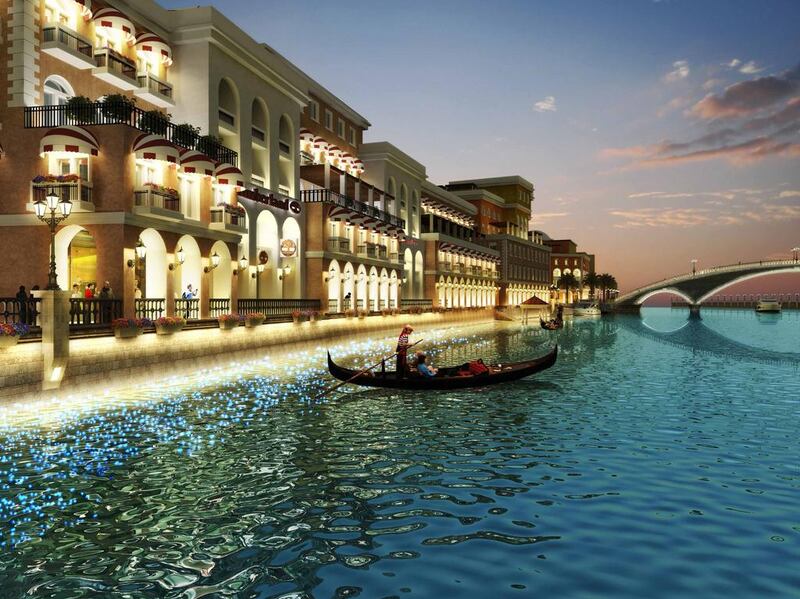 Boats will pass along the canal above the traffic on Dubai’s busiest motorway.