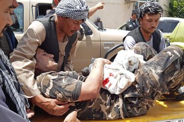 A member of Afghanistan's National Directorate of Security is taken to hospital after being wounded in a Taliban bombing in Aybak, a city in the northern province of Samangan, on July 13, 2020. AFP